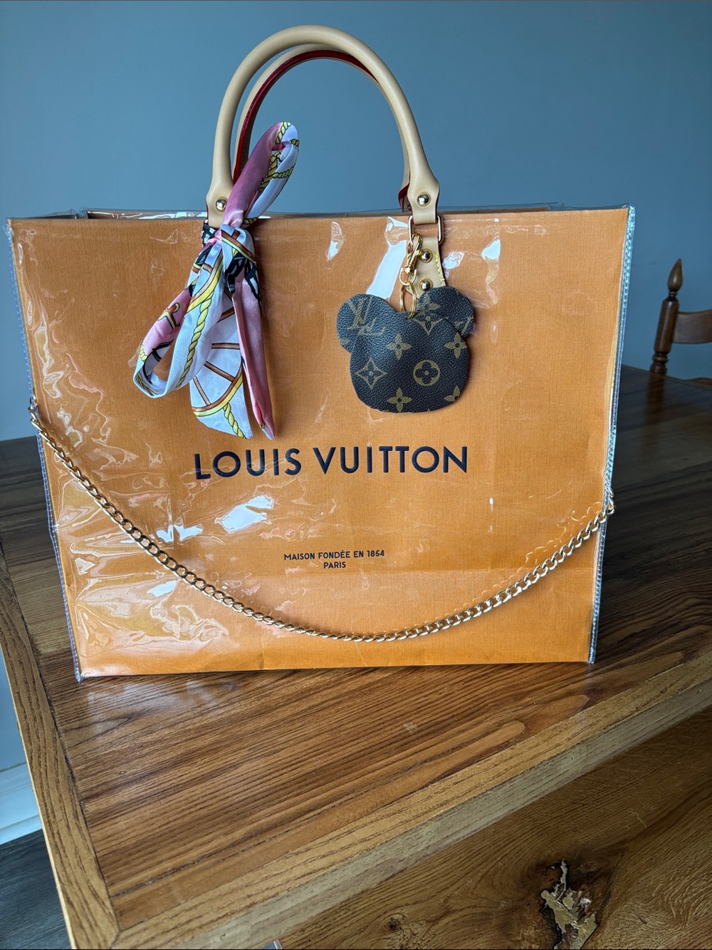 Louis Vuitton Orange PVC Tote with Pink Scarf and Monogram Charm